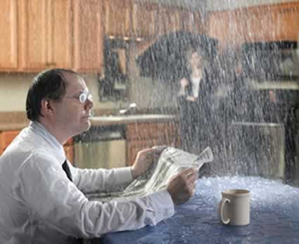 Man having a bad day with water damage