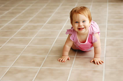 Baby crawling on tile & grout after cleaning in Tulsa